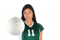 Female volleyball player holding ball.